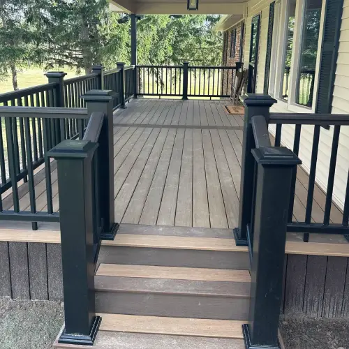Composite deck with black railings showing durable, low-maintenance outdoor flooring by Union Properties in Mi