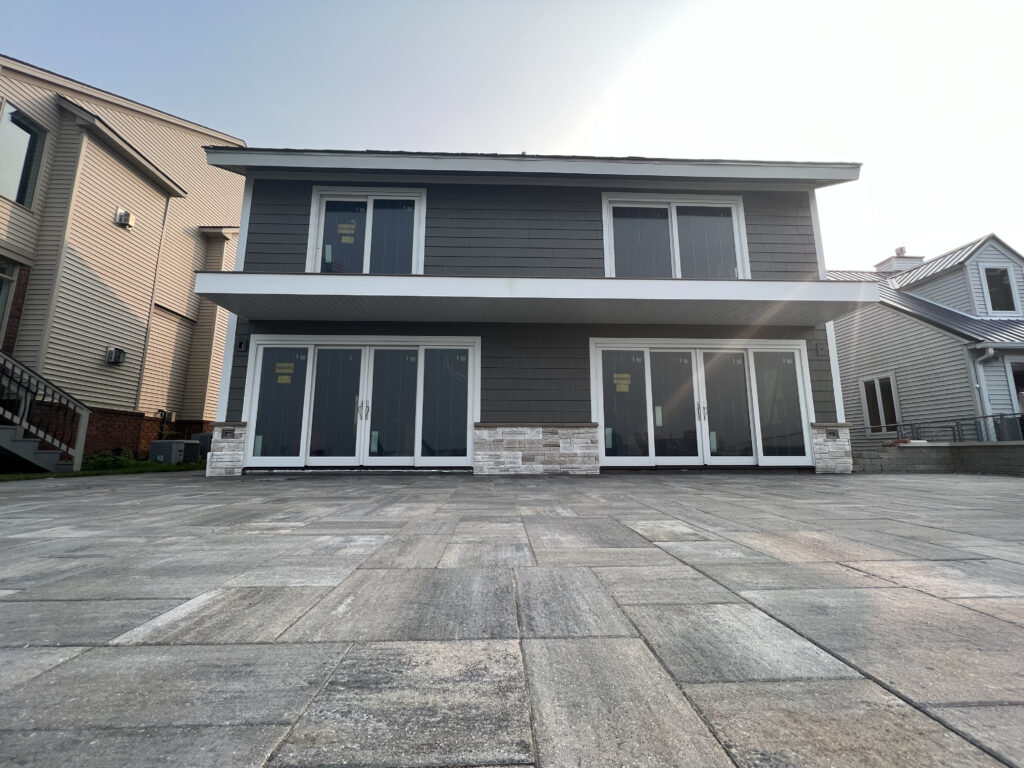 marvin window installation with a white window trim of a gray home installed by Union Properties in Port Huron, MI