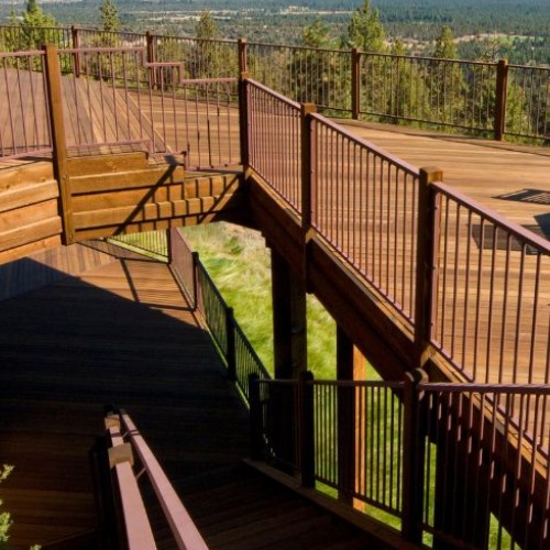 Elevated multi level deck builder design with strong railings and scenic landscape views by Union Properties in Michigan