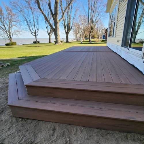 Modern composite deck showcasing professional deck resurfacing vs replacement by Union Properties in Michigan